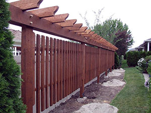A long dividing pergola spanning across a backyard for privacy from a neighbour
